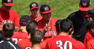 Keith Griffin speaks to his Amsterdam team in a huddle before a game in Boonville in 2017